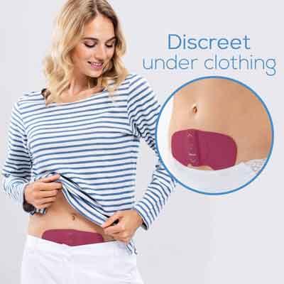 Image of a woman wearing Beurer EM 50 underneath clothing