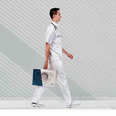 Image of a man carrying Minze Hospiflow