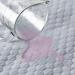 Image of absorbent floor mat soaking up spilled water