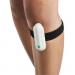 Image of Kneease strapped to the knee during treatment of knee pain